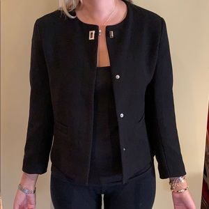 Short blazer with metal details. Never worn
